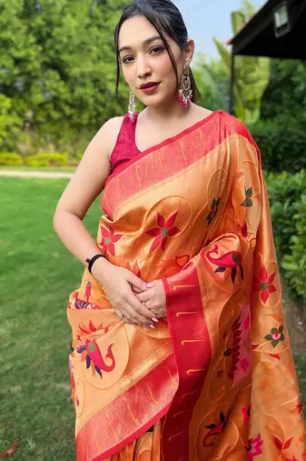 traditional orange silk blend saree with vibrant floral motifs  