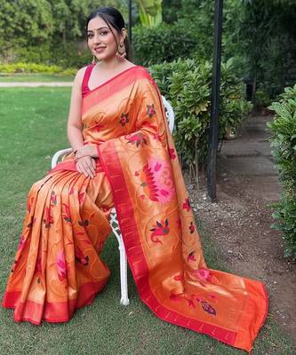 traditional orange silk blend saree with vibrant floral motifs   4
