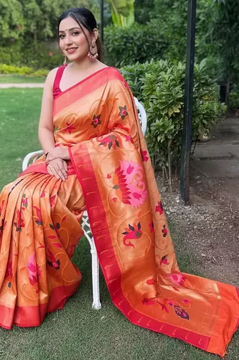 traditional orange silk blend saree with vibrant floral motifs  