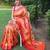 Traditional orange paithani saree with vibrant floral motifs