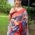 Traditional violet silk blend saree with vibrant floral motifs
