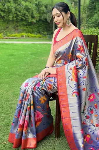 Traditional violet silk blend saree with vibrant floral motifs
