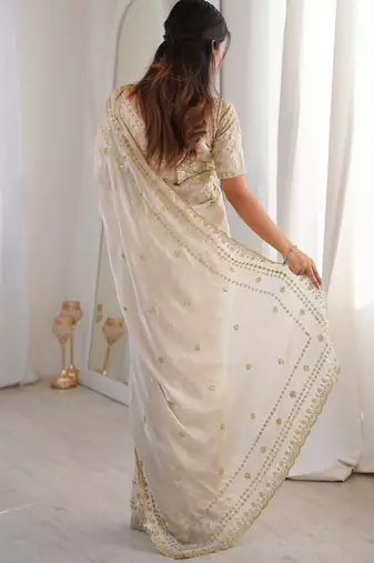 Cream color beautiful sequins work heavy partywear saree