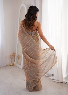 Chiku color stylish bollywood looks fendy satin fabric saree 2