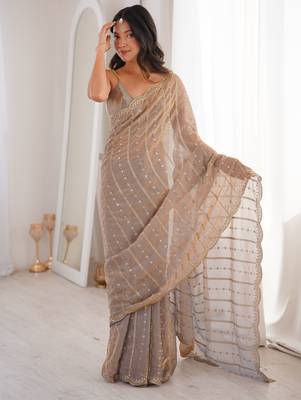 Chiku color stylish bollywood looks fendy satin fabric saree 4