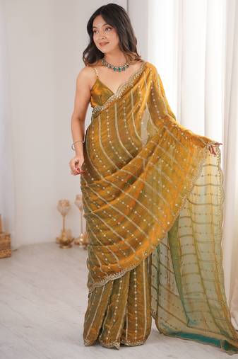 Gold color stylish bollywood looks fendy satin fabric saree