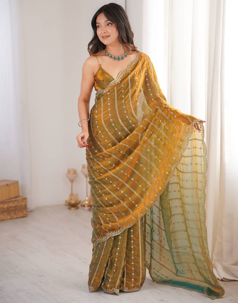 Gold color stylish bollywood looks fendy satin fabric saree