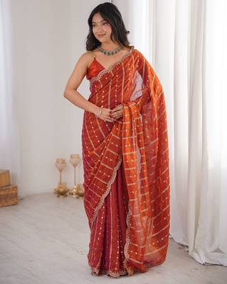 Orange color stylish bollywood looks fendy satin fabric saree 1