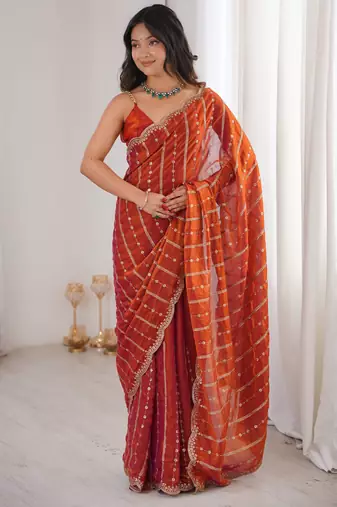 Orange color stylish bollywood looks fendy satin fabric saree