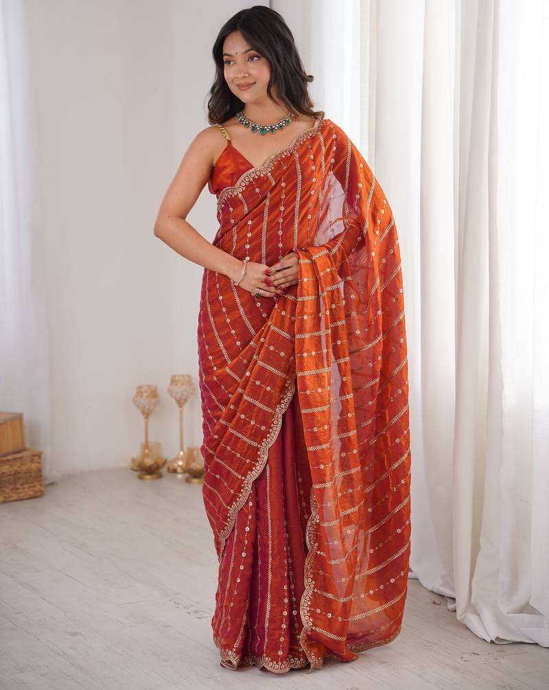 Orange color stylish bollywood looks fendy satin fabric saree
