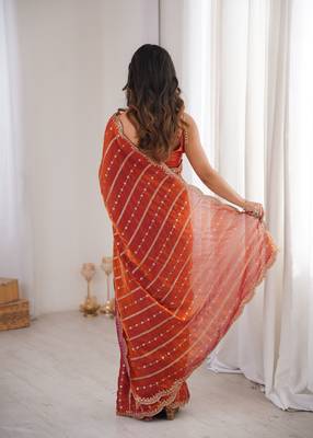 Orange color stylish bollywood looks fendy satin fabric saree 2