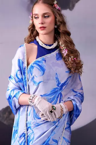 Beautiful and rich looks blue color floral printed satin silk saree