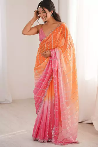 Orange color fendy satin fabric beautiful fancy embroidered saree