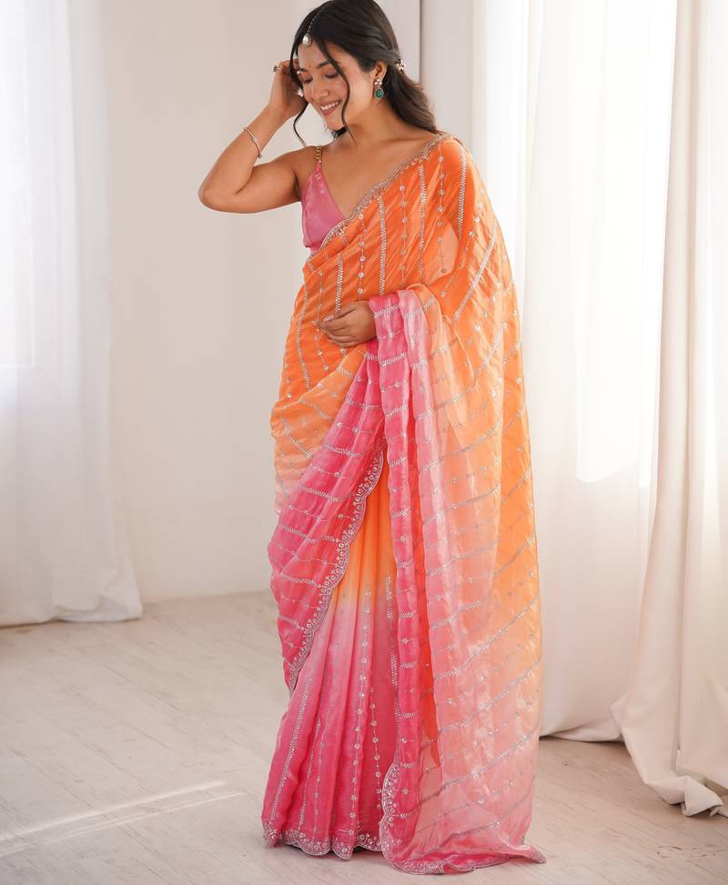 Orange color fendy satin fabric beautiful fancy embroidered saree
