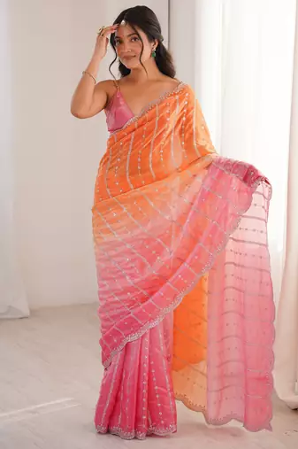 Orange color fendy satin fabric beautiful fancy embroidered saree