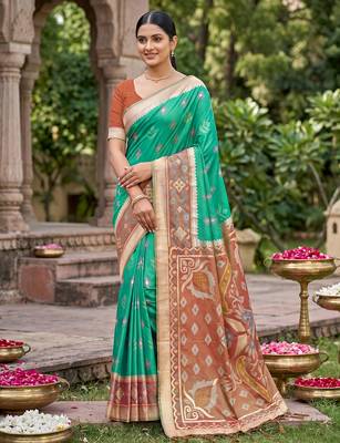 Rama green color soft silk fabric woven designer partywear saree 1