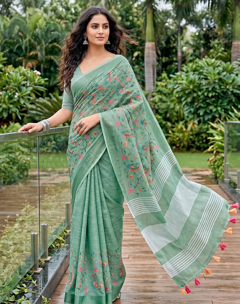Sea green color linen fabric beautiful fancy embroidered saree