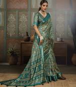 Green color beautiful ethnic partywear saree for traditional rich looks