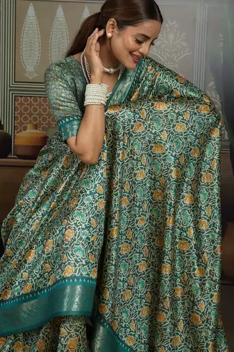 Green color beautiful ethnic partywear saree for traditional rich looks