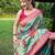 Traditional rama green silk blend saree with vibrant floral motifs