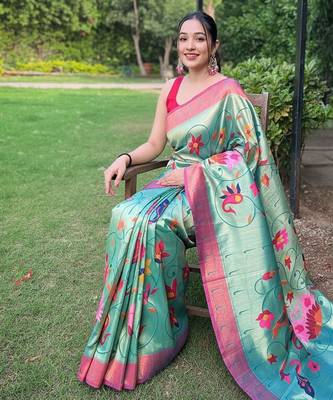 Traditional rama green silk blend saree with vibrant floral motifs 4