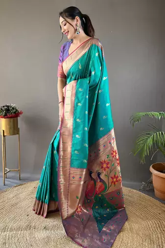 Rama green color silk blend saree with rich contrast weaving pallu & border and beautiful buttis