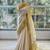 Cream art silk woven saree with hand print