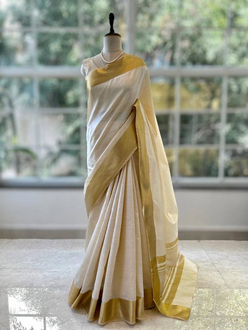 Cream art silk woven saree with hand print