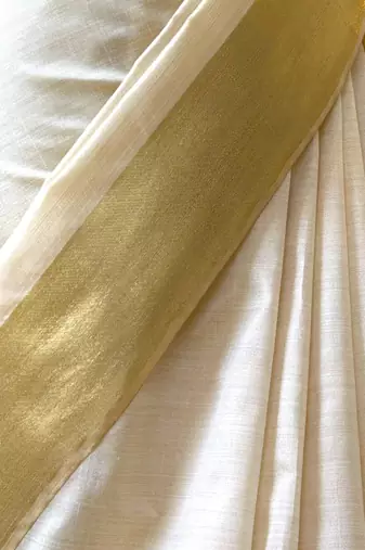 Cream art silk woven saree with hand print