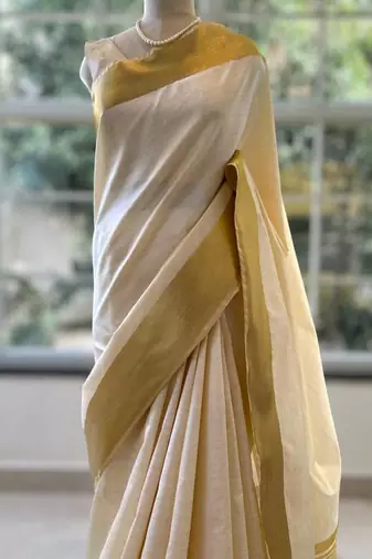 Cream art silk woven saree with hand print