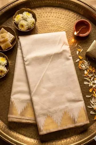 Cream art silk woven saree with hand print