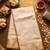 Cream art silk woven saree with hand print
