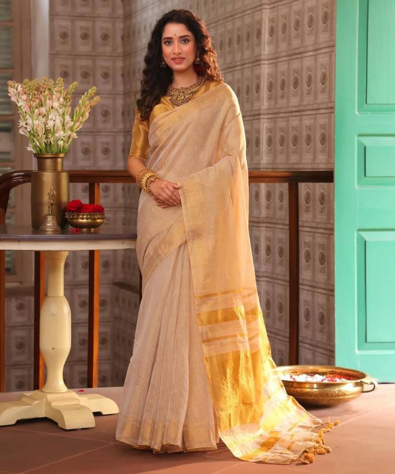 Cream art silk woven saree with zari work