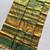 Green art silk woven saree with zari work