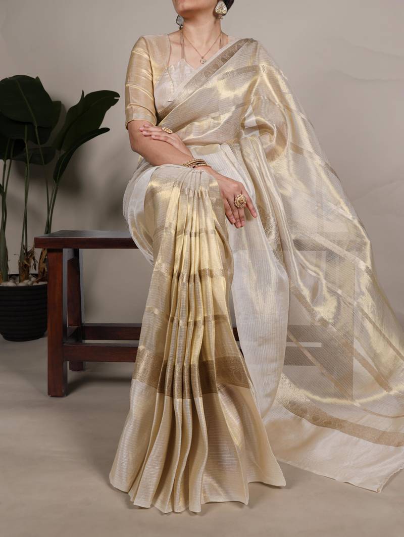 Beige tissue woven saree with zari work