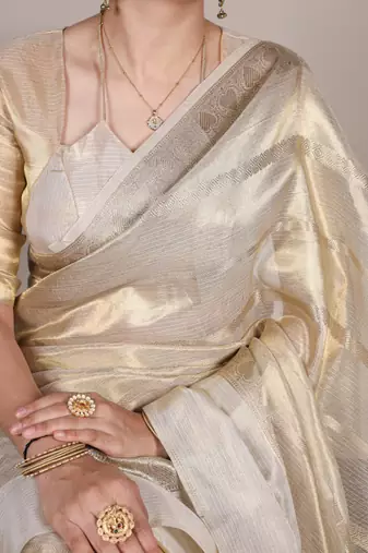 Beige tissue woven saree with zari work