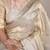 Beige tissue woven saree with zari work