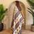 Beige viscose printed saree with zari work