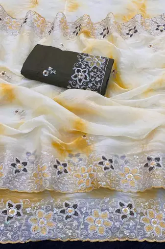 Cream silk blend embroidered saree with tie dye