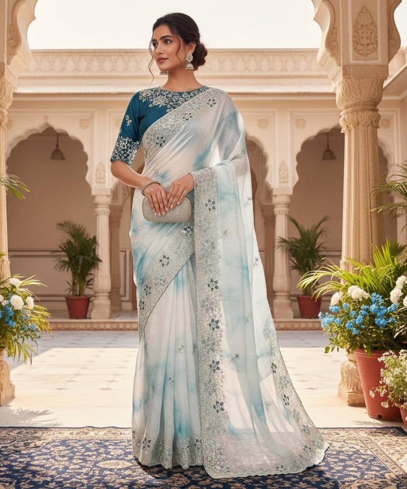 Teal silk blend embroidered saree with tie dye