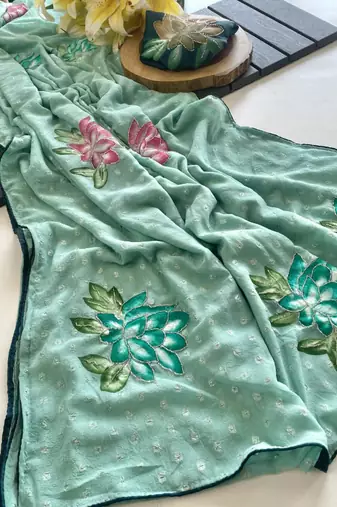 Sea green georgette printed saree with floral print