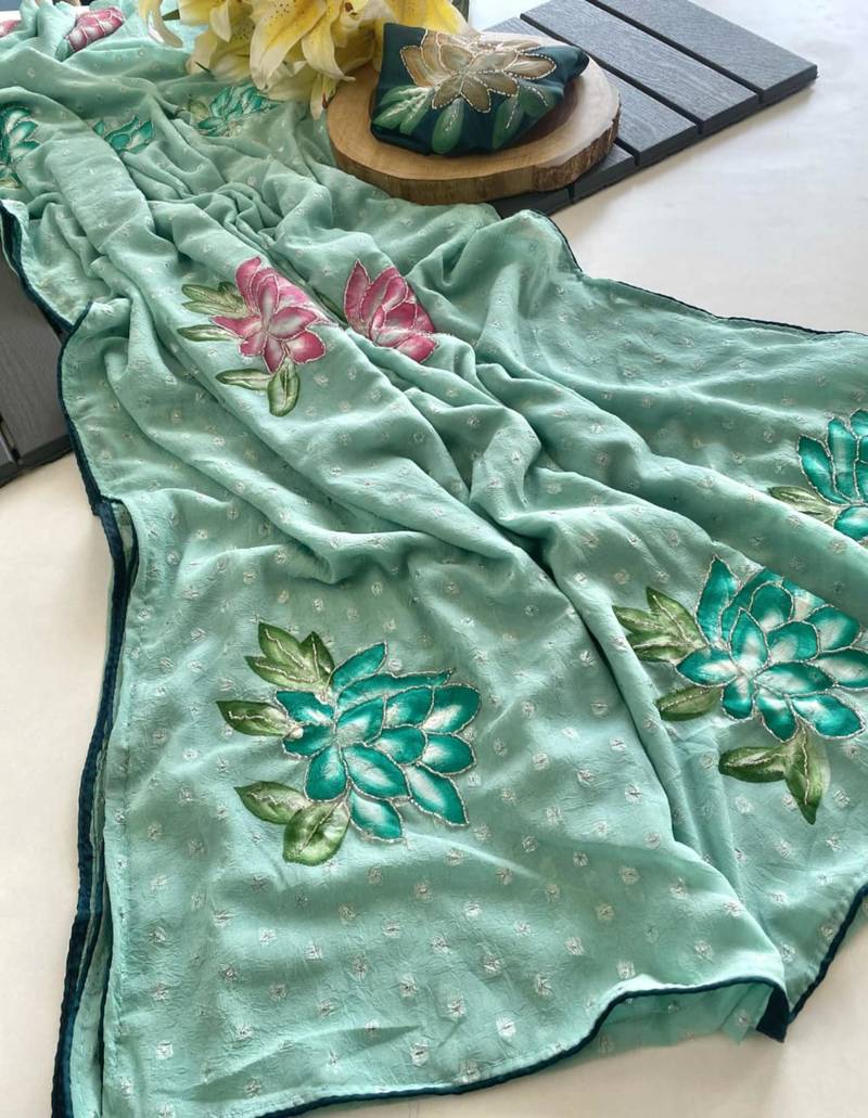 Sea green georgette printed saree with floral print