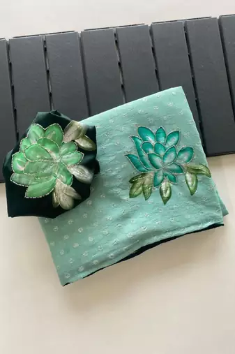 Sea green georgette printed saree with floral print