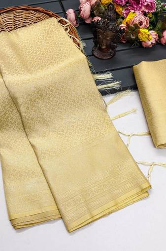 Beige silk blend woven saree with zari work