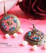 Round brass earrings with blue highlights