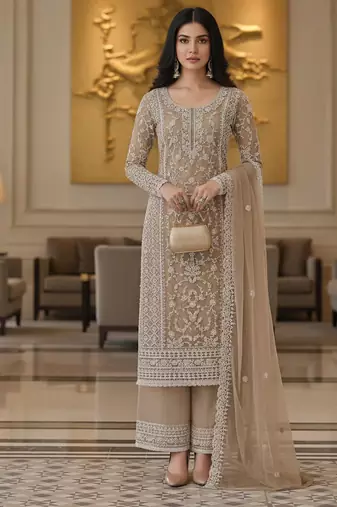 Beige color girlie butterfly net ceremonial salwar kameez for glamorous looks