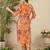Orange floral screen printed v-neck straight kurta with trousers