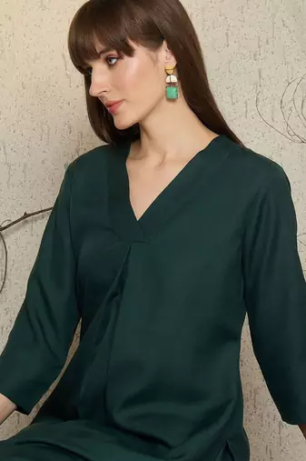 Green pleated v-neck a-line kurta with trousers