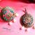 Round brass earrings with blue highlights