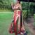 Traditional olive green silk blend saree with vibrant floral motifs